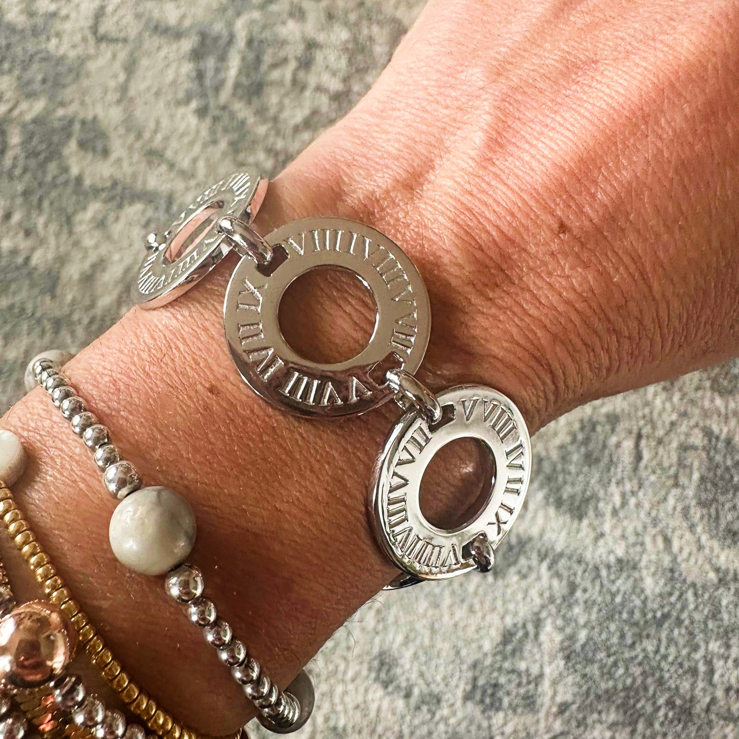 Circa Bracelet in 925 sterling silver features 6 flat rings imprinted with Bellagio & Co signature Roman numerals. Shop affordable luxury jewellery. Worldwide shipping from Australia.